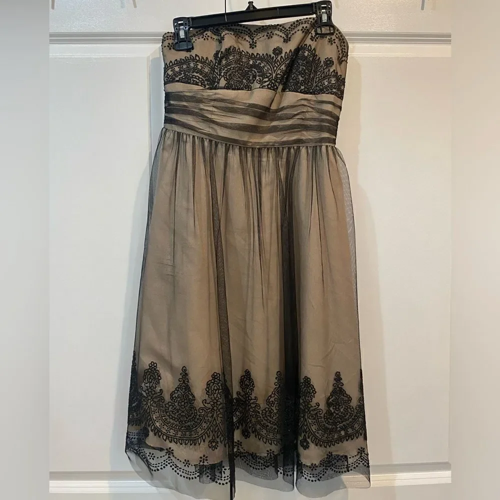 David’s bridal strapless dress with bead detail and sparkle. Worn once. EUC
